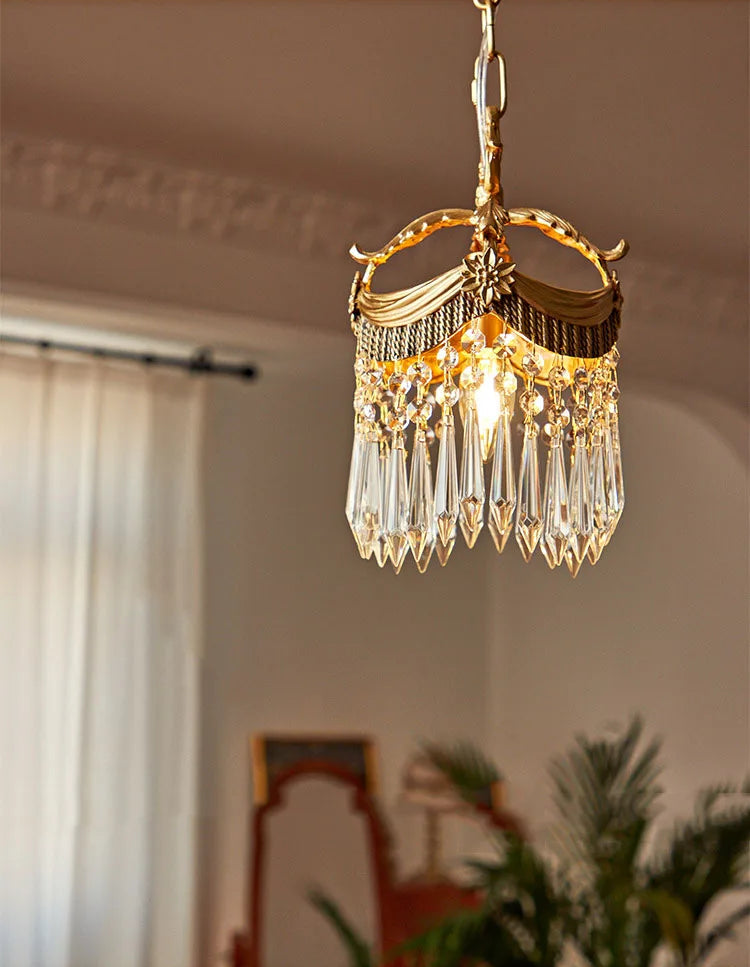 Luxury French Velvet Tassel Chandelier with copper frame and crystal drops, suspended in a refined living room setting.