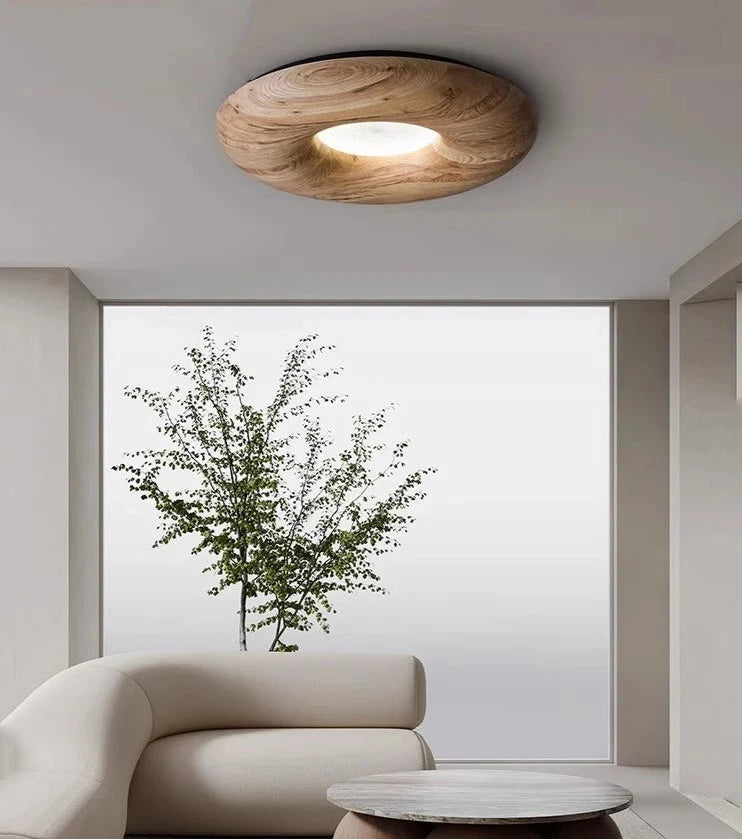 Light wood Nordic ceiling light in a bright modern living room, ideal for soft ambient lighting and Scandinavian-inspired decor.