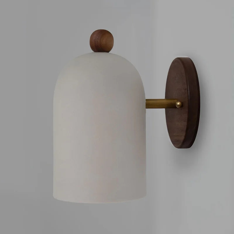 White dome walnut wood wall sconce with brass connector, perfect for minimalist bedroom or hallway lighting.
