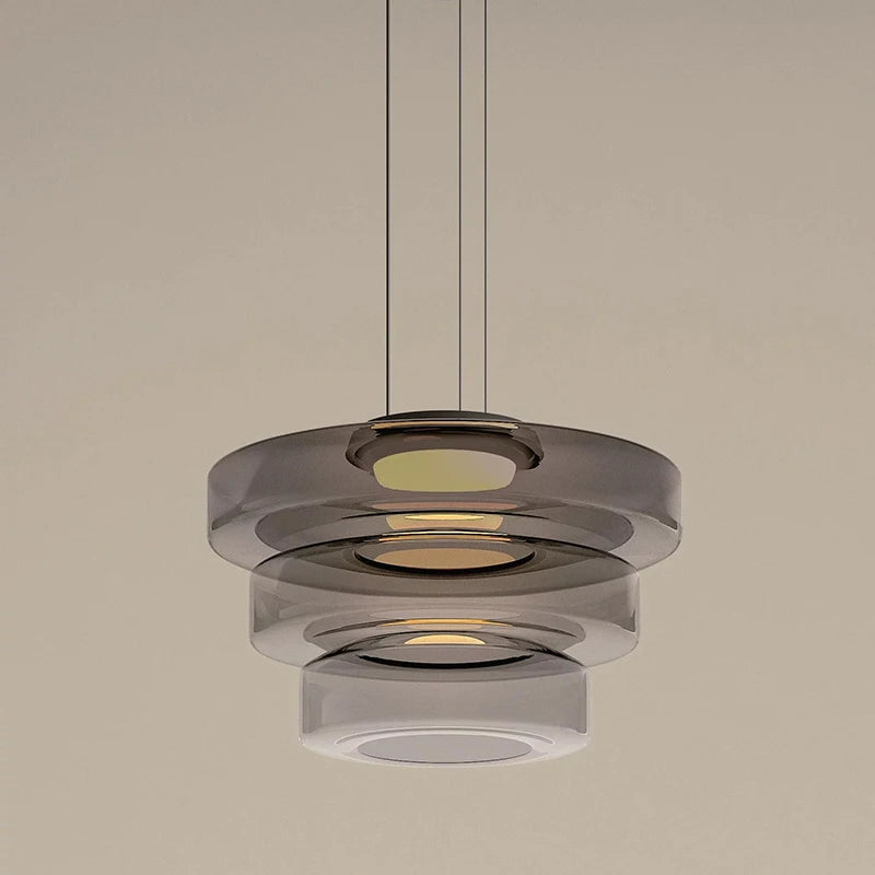 Two-tier smoke grey glass pendant light with LED source. Adds a modern touch to kitchen or dining room interiors.