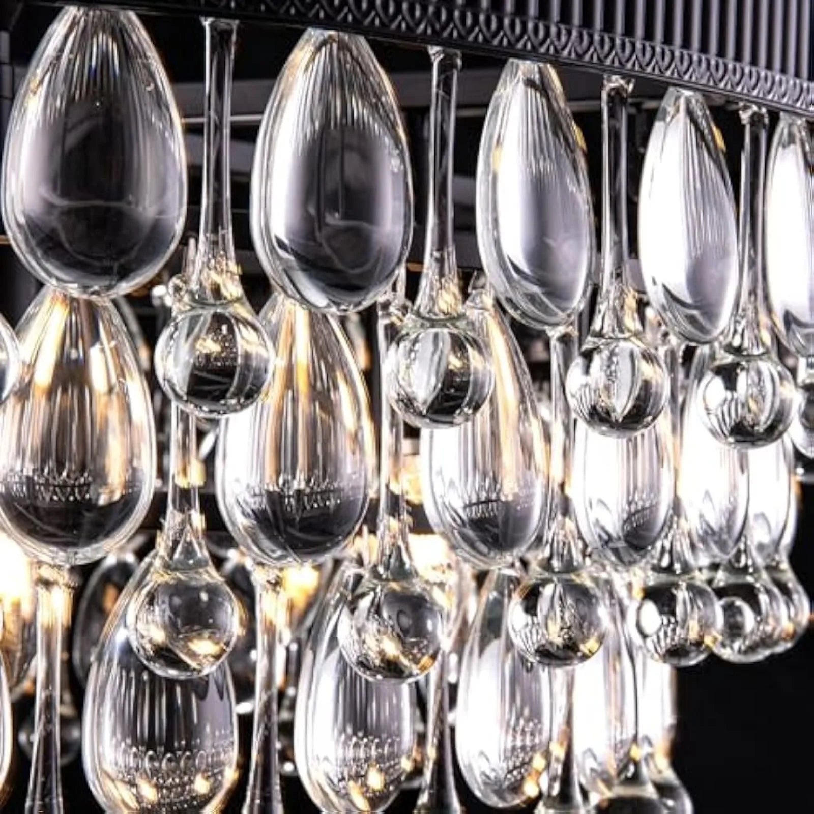 Close-up of K9 crystal teardrops on modern chandelier, showcasing elegant craftsmanship and premium lighting detail for upscale decor.