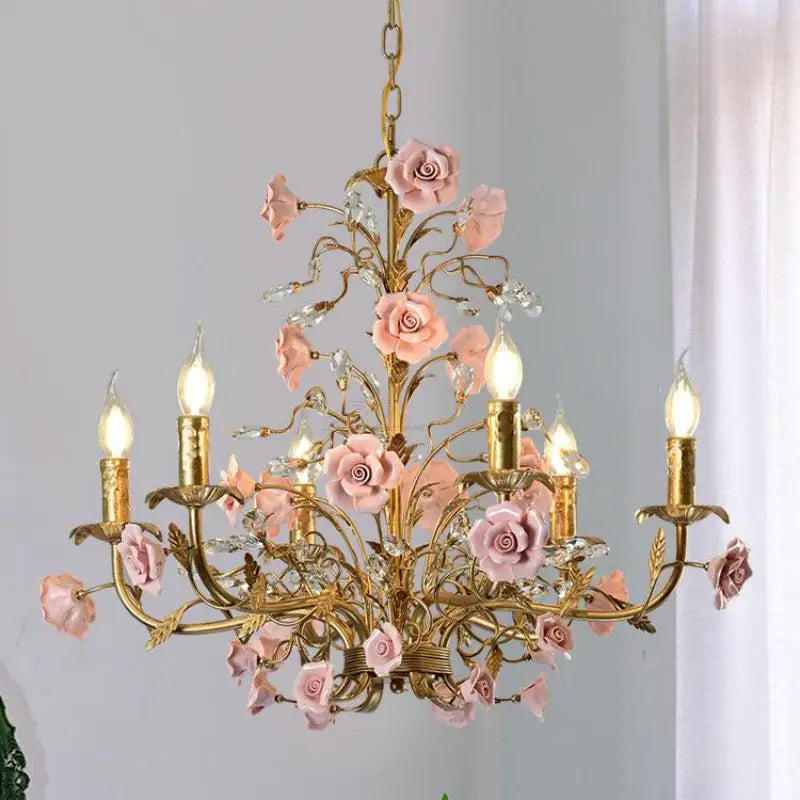 French pink rose ceiling light with soft blush ceramic flowers and ornate gold arms, perfect for elegant home or retail lighting décor.