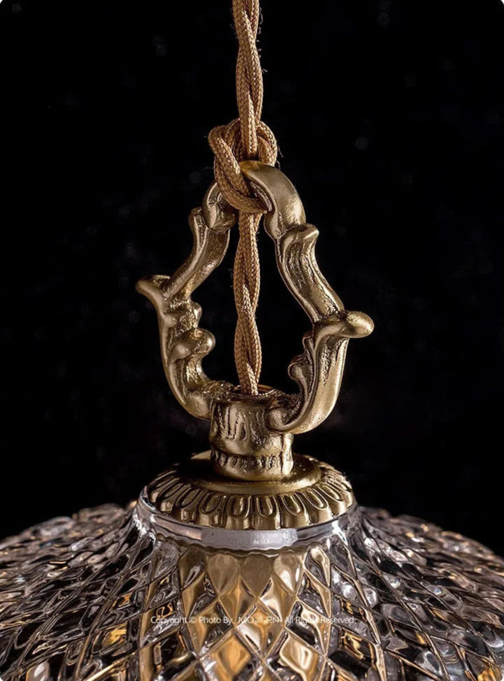 Ornate brass hook detail on French Vintage Crystal Chandelier - Copper Hanging Lamp with twisted cord suspension.