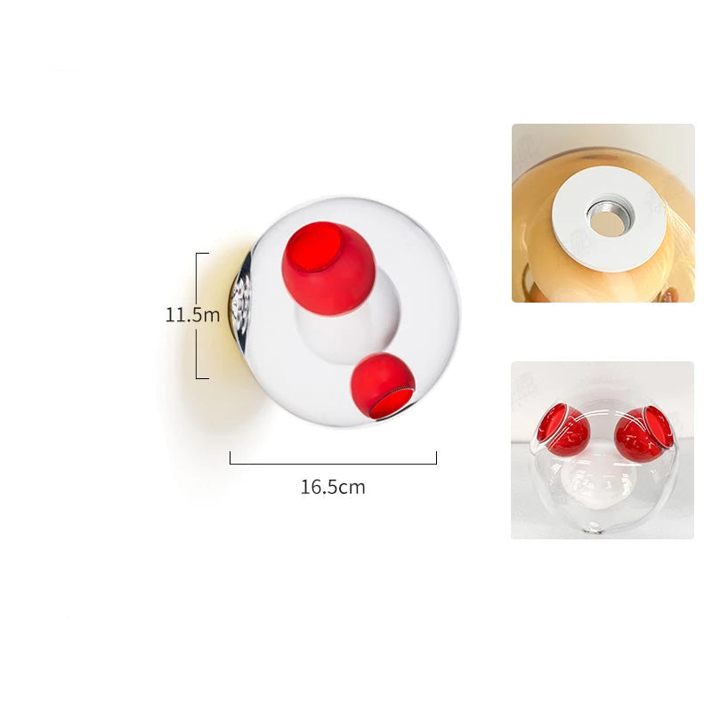 Clear and red glass ball LED wall sconce with Italian designer style, perfect for bold and artistic lighting in modern interiors.