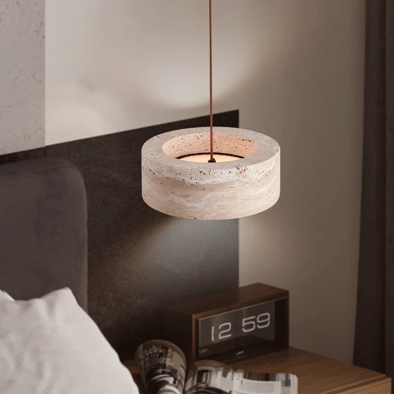 Travertine Retro Pendant Light installed beside a bed, casting a cozy glow ideal for modern bedroom lighting and night-time reading.