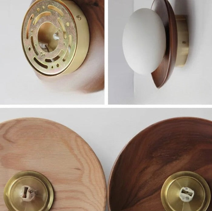 Close-up of LUXELY wall sconce components showing brass mount and wood base, highlighting craftsmanship details.