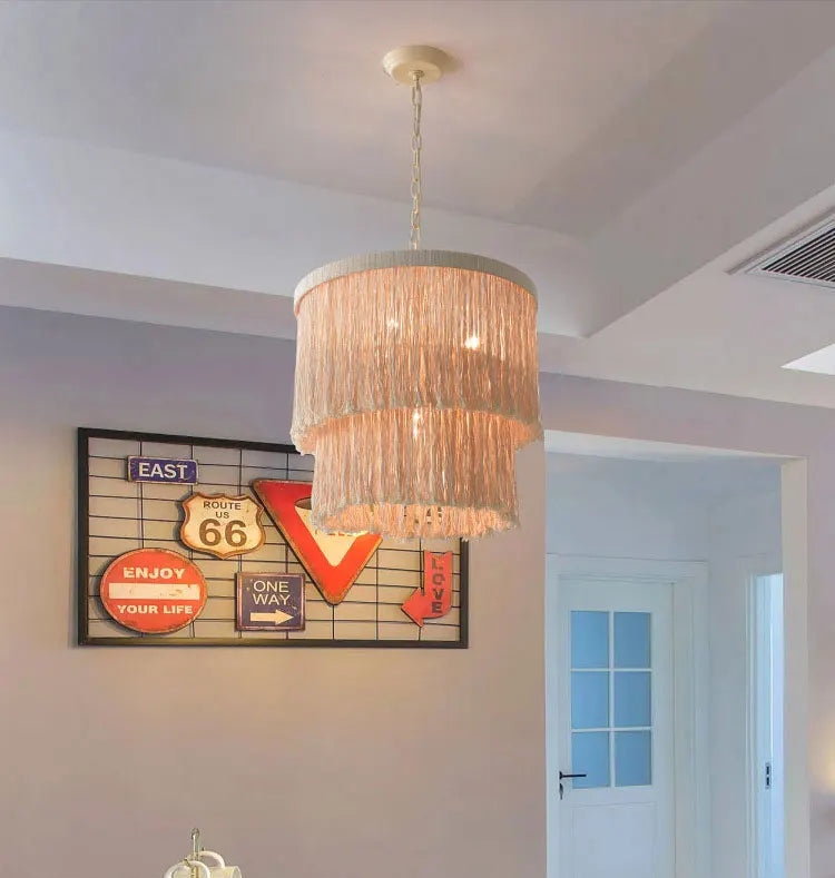 Rustic Bohemian Chandelier-Pendant Light Wicker LED illuminating a hallway with Route 66 wall art, ideal for eclectic interiors.