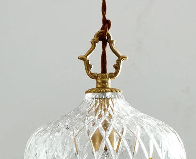 Top detail of French Vintage Crystal Chandelier - Copper Hanging Lamp showing ornate brass hook and twisted cord.