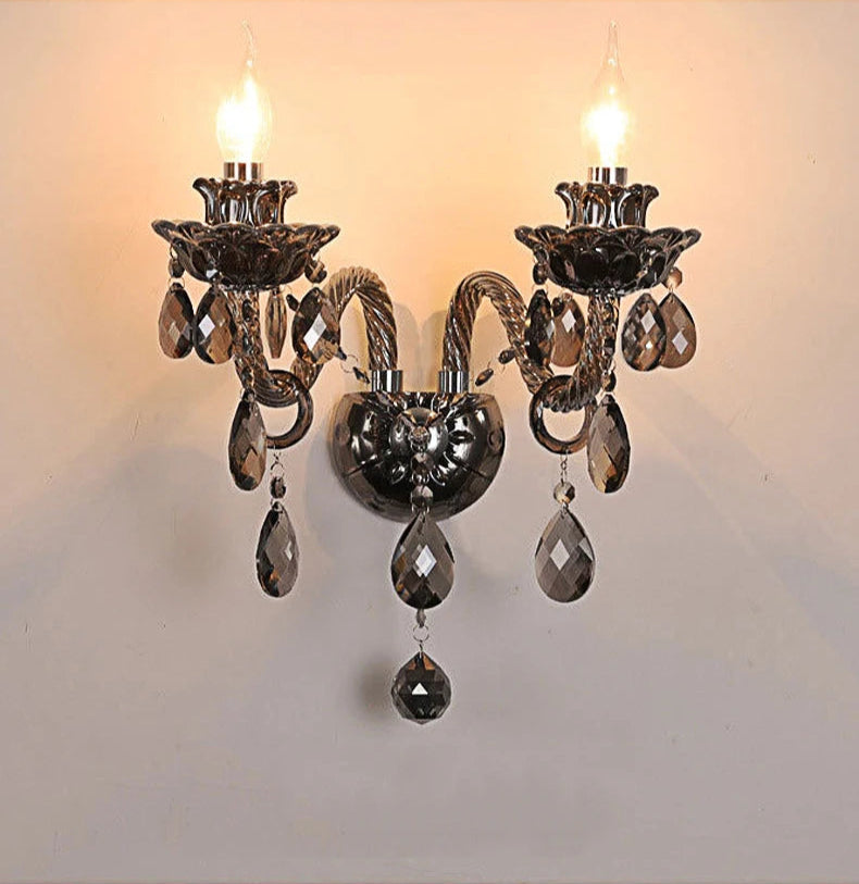 Double-arm vintage crystal wall sconce in dark chrome with lotus design and LED bulbs, suitable for French-style home lighting.