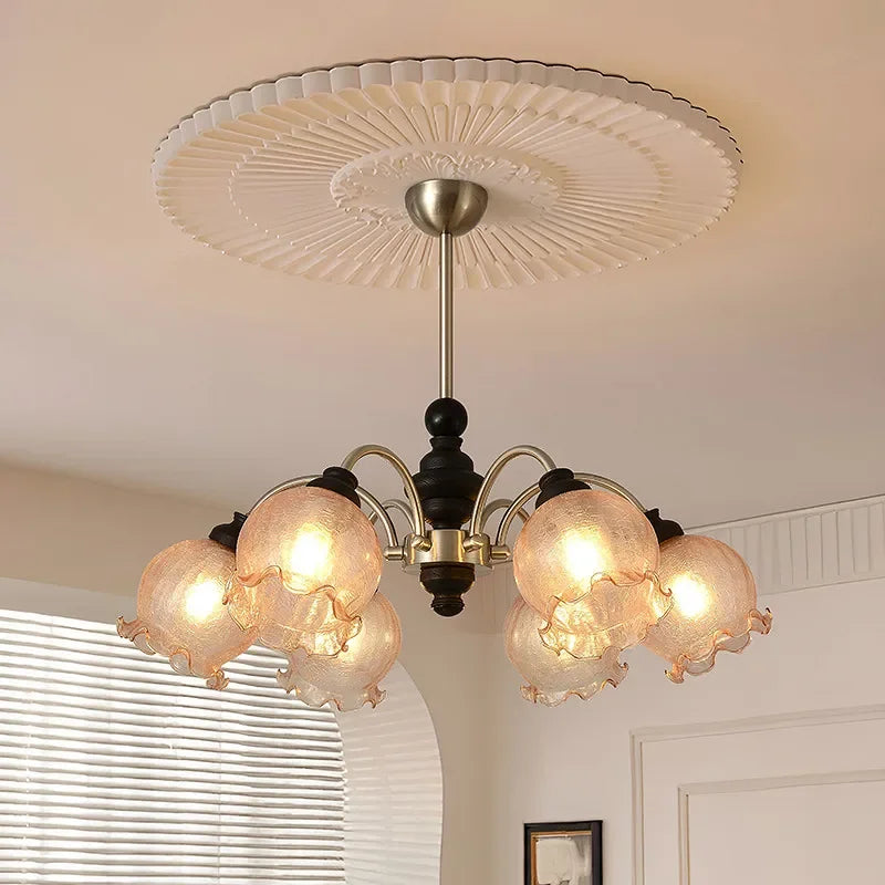 Modern American chandelier with LED lights and pink-tinted crystal shades, perfect for home interiors with classic ceiling decor.