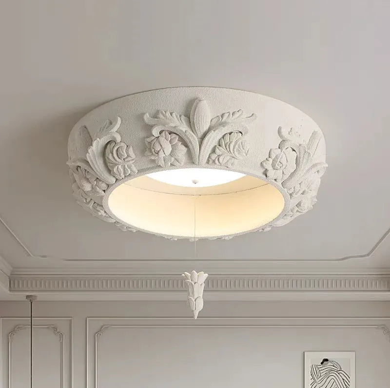 Flush-mounted carved plaster chandelier - french farmhouse ceiling light featuring ornate floral patterns and soft LED glow.