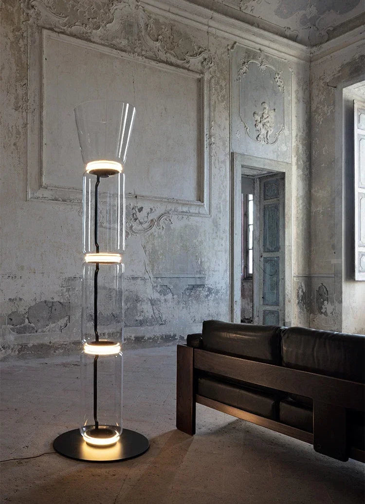 Elegant Italian glass floor lamp – modern minimalist nordic design with LED lighting, styled in a rustic luxury living room.