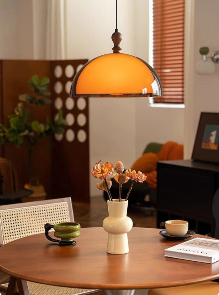LED Pendant Light above a round dining table, blending modern design with warm lighting for home interiors.