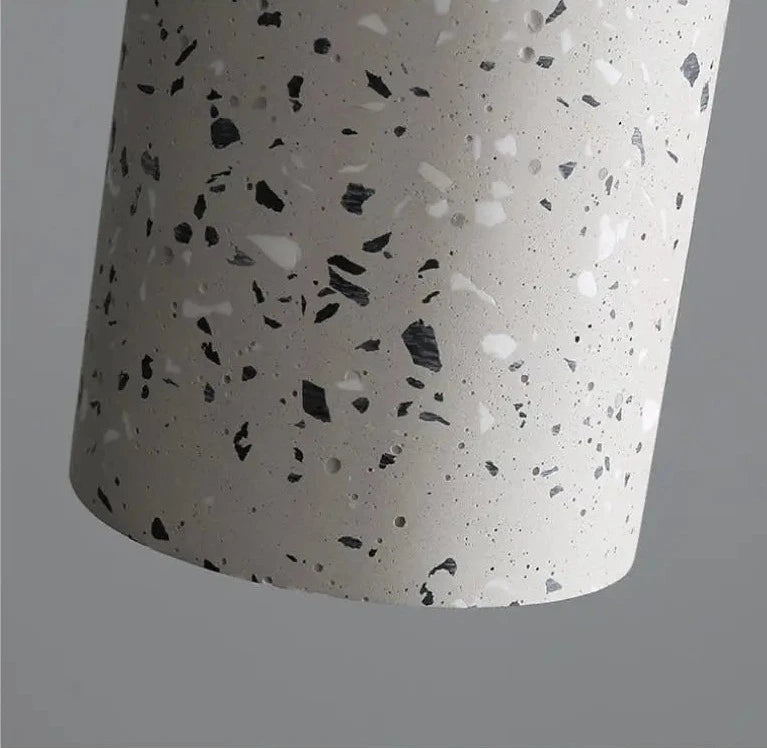 Close-up of terrazzo finish on LUXELY cement pendant lamp. Durable and stylish lighting for modern home or commercial spaces.