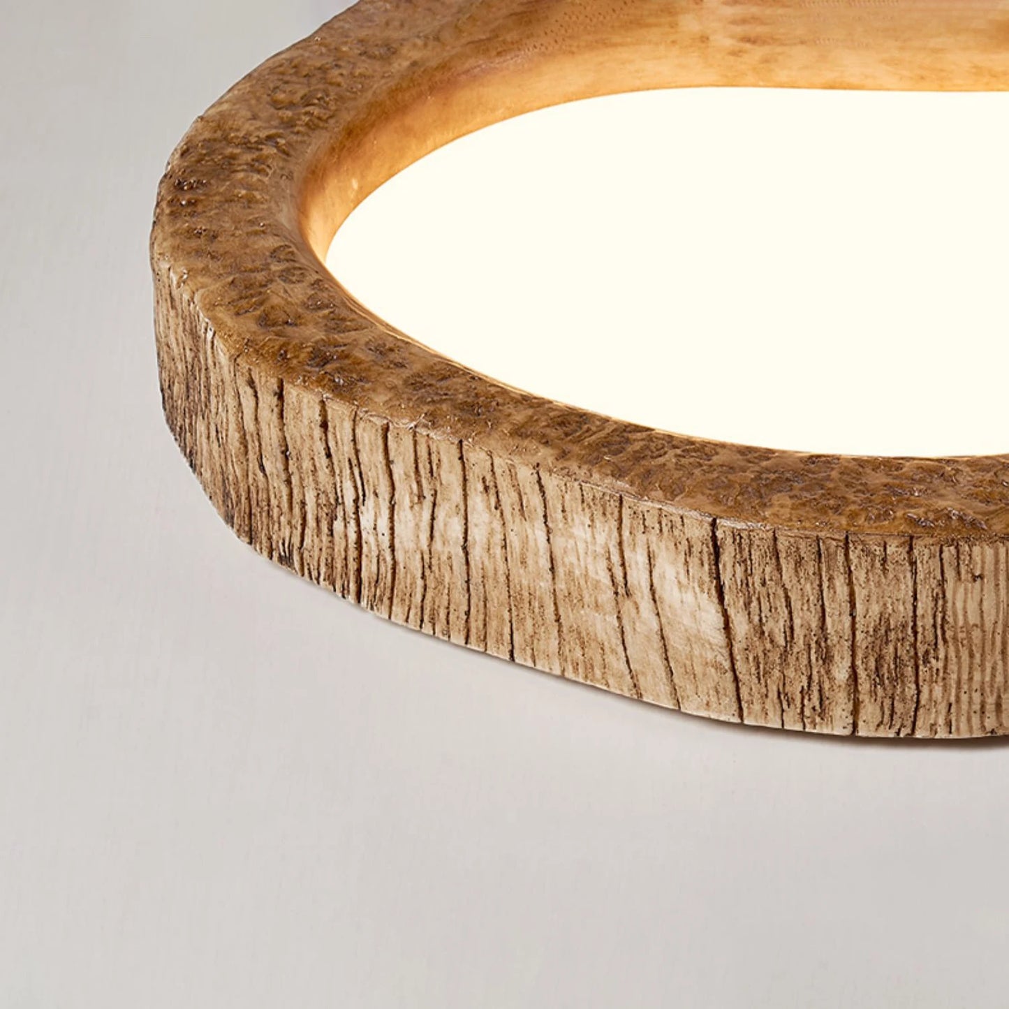 Close-up of LUXELY modern ceiling light showing detailed wood grain texture and smooth resin finish for stylish home lighting.