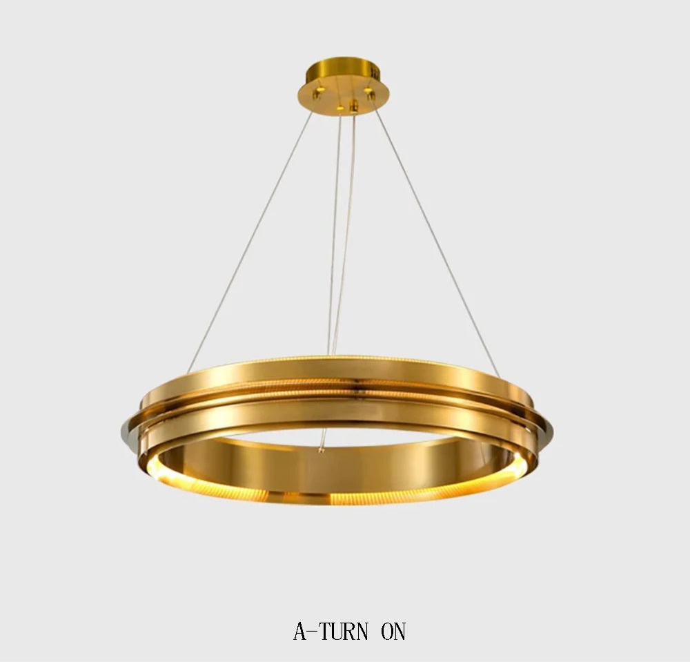 Titanium gold LED chandelier turned on, featuring a sleek ring design ideal for modern dining or living rooms.