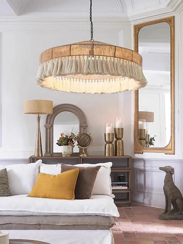 Handmade VIGOUS Rattan Pendant Light hanging in a modern living room, adding rustic charm and soft lighting to the decor.