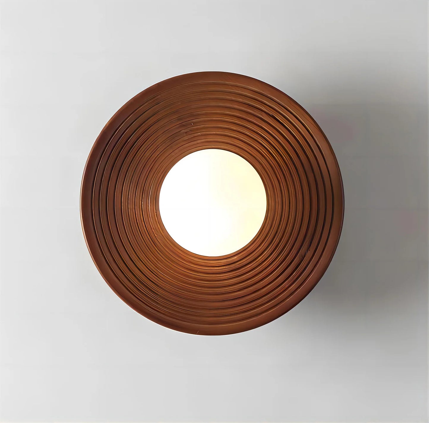 Top view of the LUXELY walnut wood ceiling light with concentric carved design and central globe bulb, ideal for modern decor.