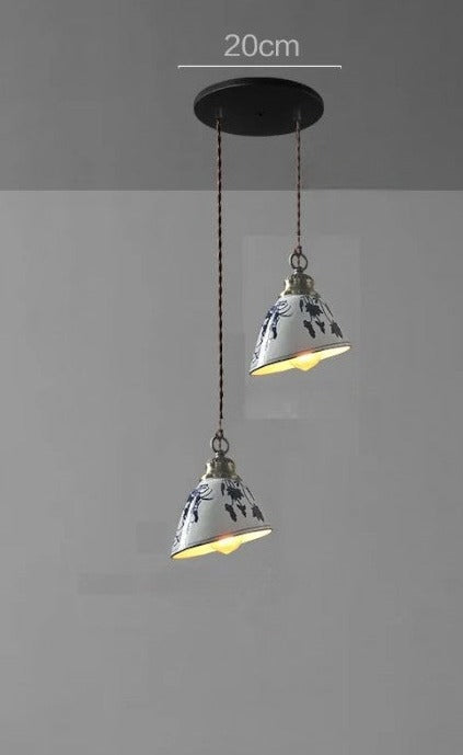 Two cone-shaped ceramic pendant lights with blue floral patterns on a 20cm mount, perfect for vintage kitchen lighting.