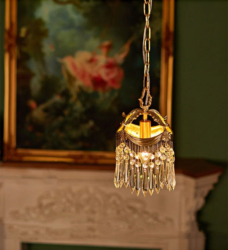 French Velvet Tassel Pendant Light glowing warmly in a classic room, featuring crystal drops and copper detailing.