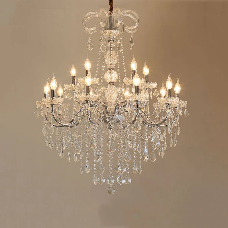Large golden crystal chandelier with multiple LED lights and layered crystal drops for grand interior spaces.