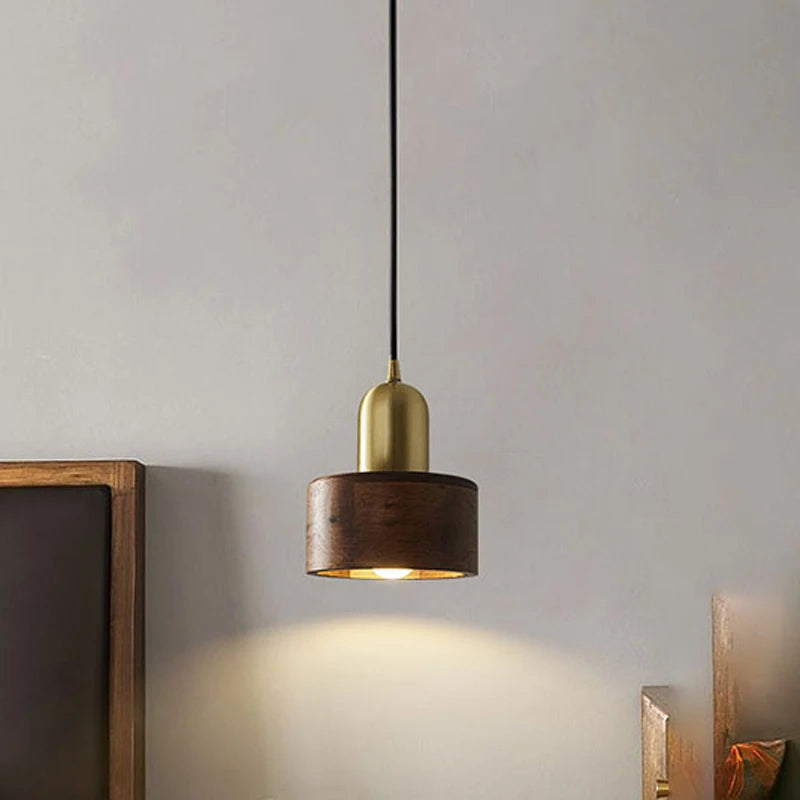 Modern Nordic wood and brass ceiling pendant by LUXELY, casting soft light in a contemporary interior setting.