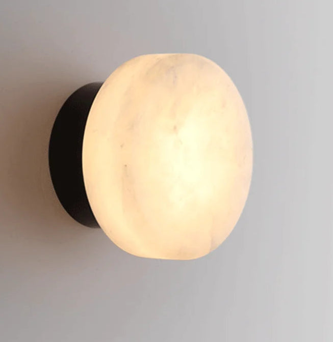 Modern LED Marble Wall Lamp with black base and glowing marble shade, perfect for contemporary home lighting design.