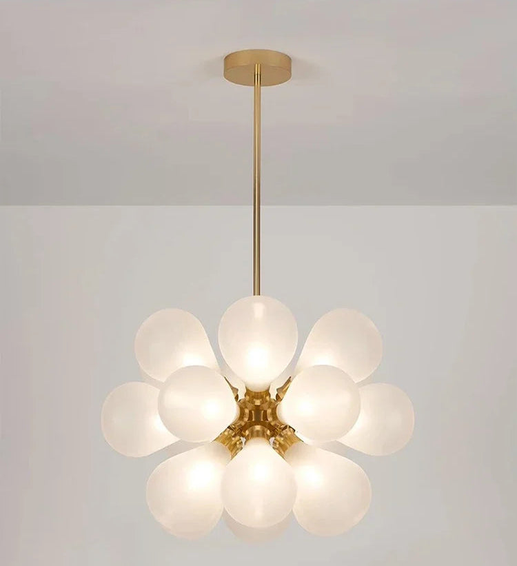 Modern white bubble glass chandelier with golden lampbody, perfect for Nordic-inspired interior lighting.