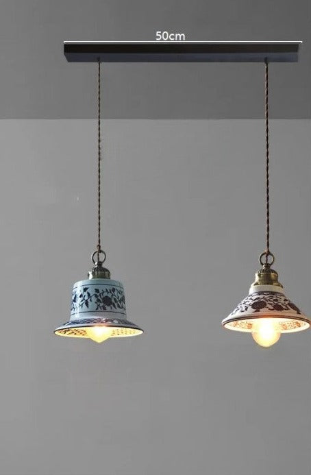 Dual ceramic pendant lights with floral patterns on a 50cm bar, perfect for rustic kitchen or bar lighting.