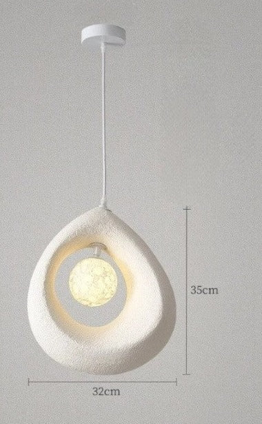 White Nordic wabi-sabi pendant light with LED bulb and white ceiling mount, perfect for minimalist dining room lighting.
