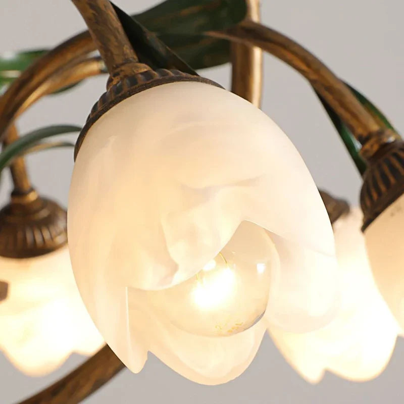 Detailed view of frosted tulip-shaped glass shade on the Scandinavian flower chandelier, highlighting its soft LED glow and floral design.
