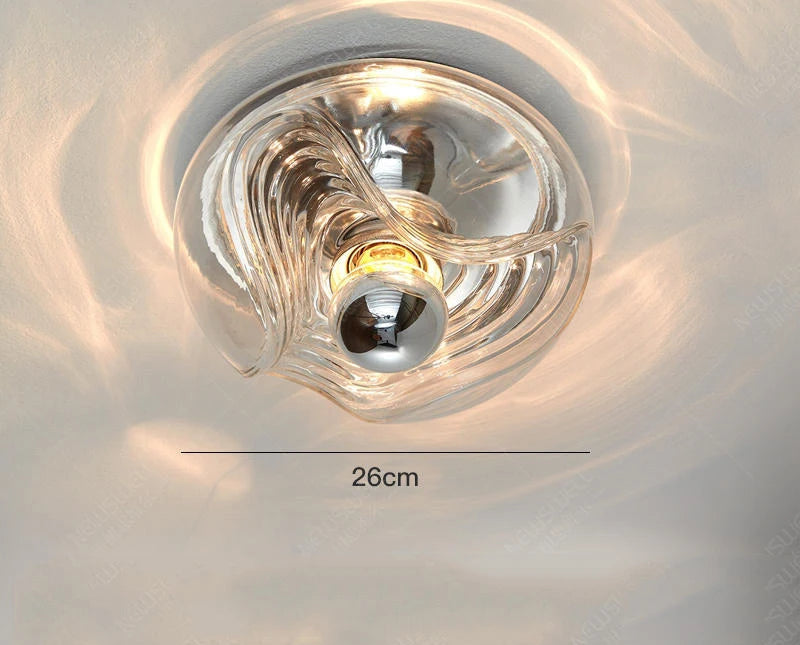 Clear designer glass wall lamp with LED light source and 26cm diameter, made from hardware and glass materials.