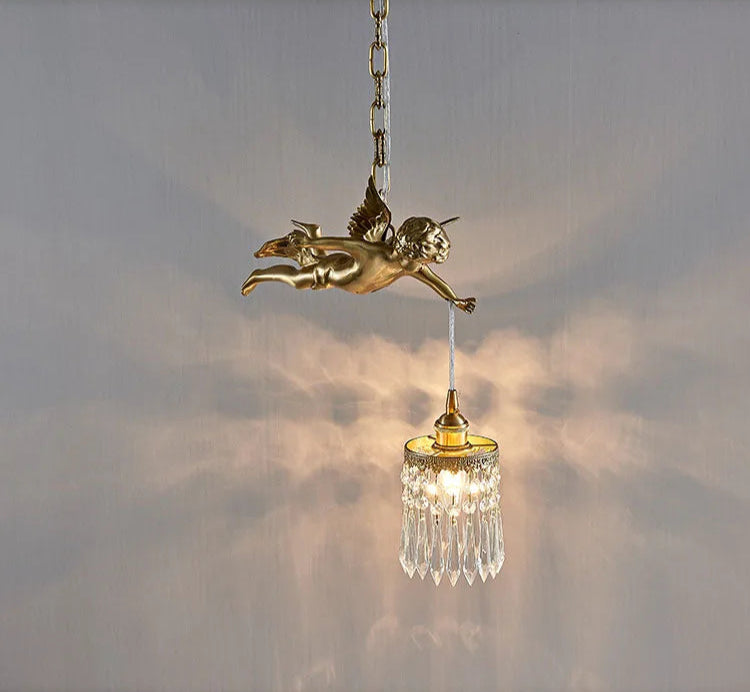 Copper angel chandelier pendant light casting decorative shadows, ideal for modern and vintage interiors.