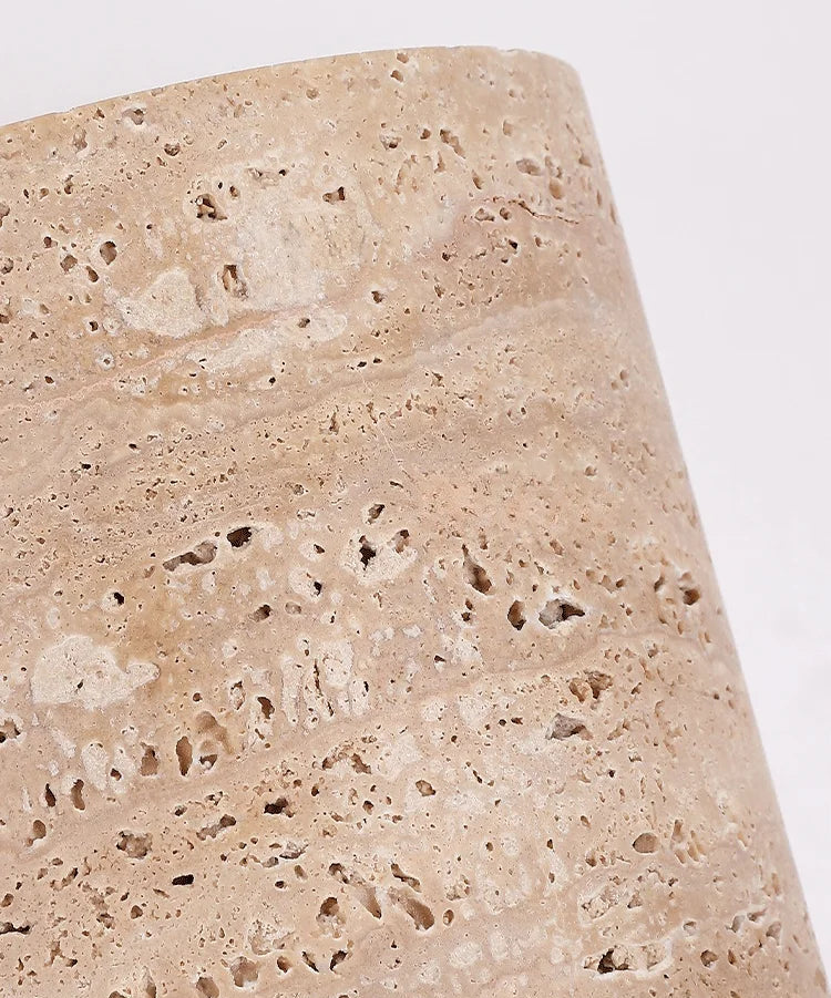 Detailed texture of natural travertine used in IP65 wall lamp, emphasizing organic stone patterns and durability.