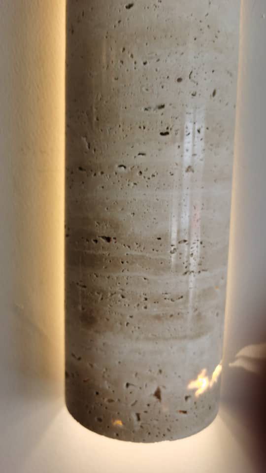 Close-up of IP65 Travertine wall lamp showing detailed stone texture and warm LED backlighting for modern wall decor.