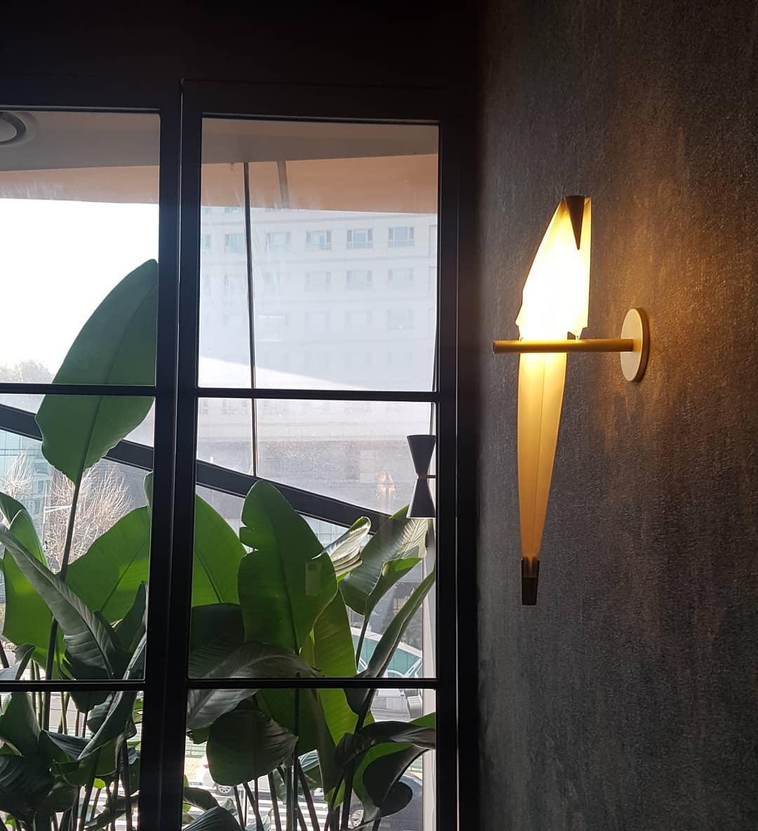 Lampe murale en forme d'oiseau