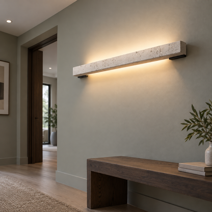 Beige stone LED bar wall light, low underside angle in a hallway