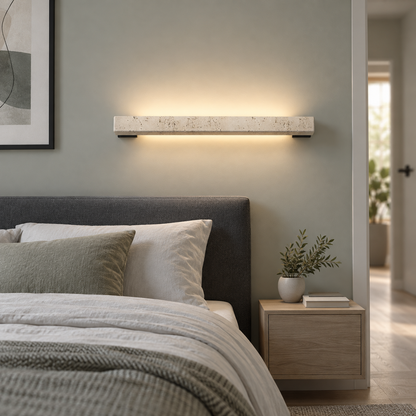 Beige stone LED bar wall light, front view installed in a modern room