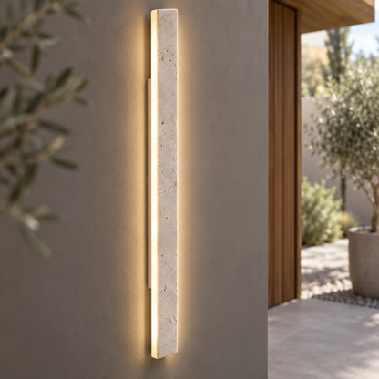 Slim beige natural stone outdoor wall light, close-up of the material and edge