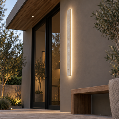 Slim beige natural stone outdoor wall light, far underside view installed outside