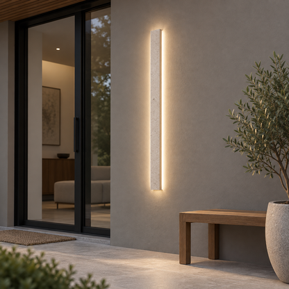 Slim beige natural stone outdoor wall light, far front view in courtyard