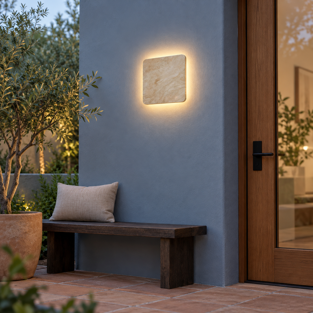Square natural stone outdoor wall light, far front view in courtyard