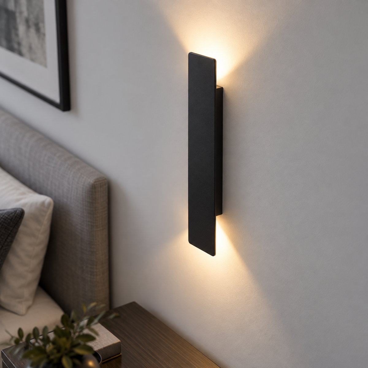 Black up and down LED bar wall light, elevated view while wall mounted