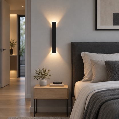 Black up and down LED bar wall light, front view installed in a modern room