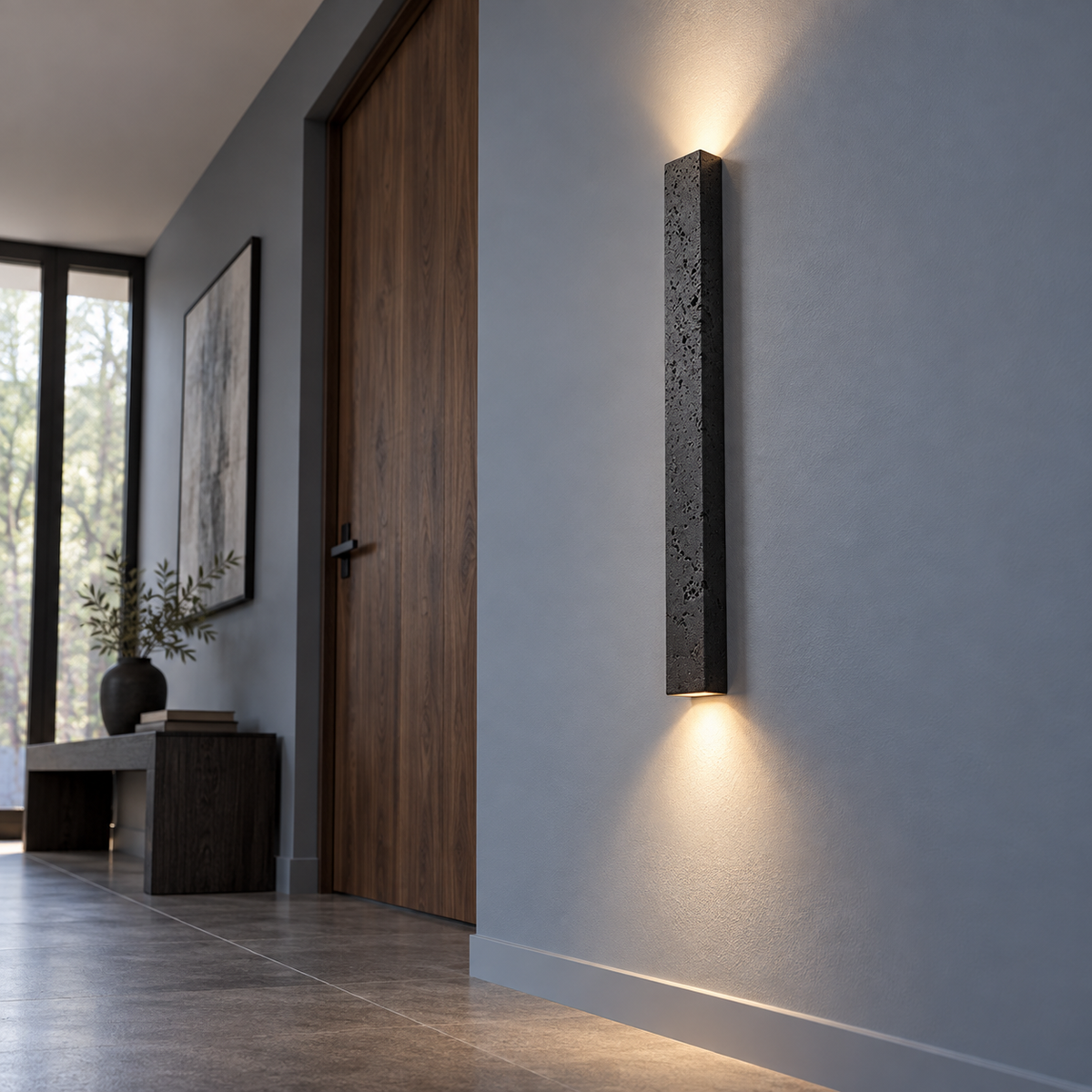 Slim black stone up and down wall light, far low underside view