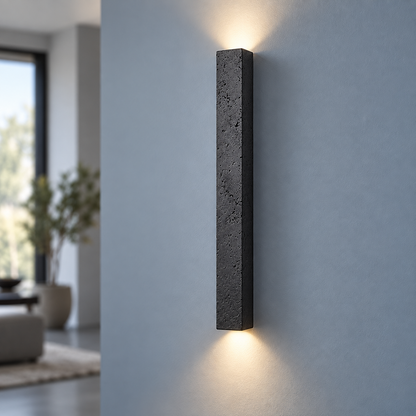 Slim black stone up and down wall light, centred commercial finish photograph
