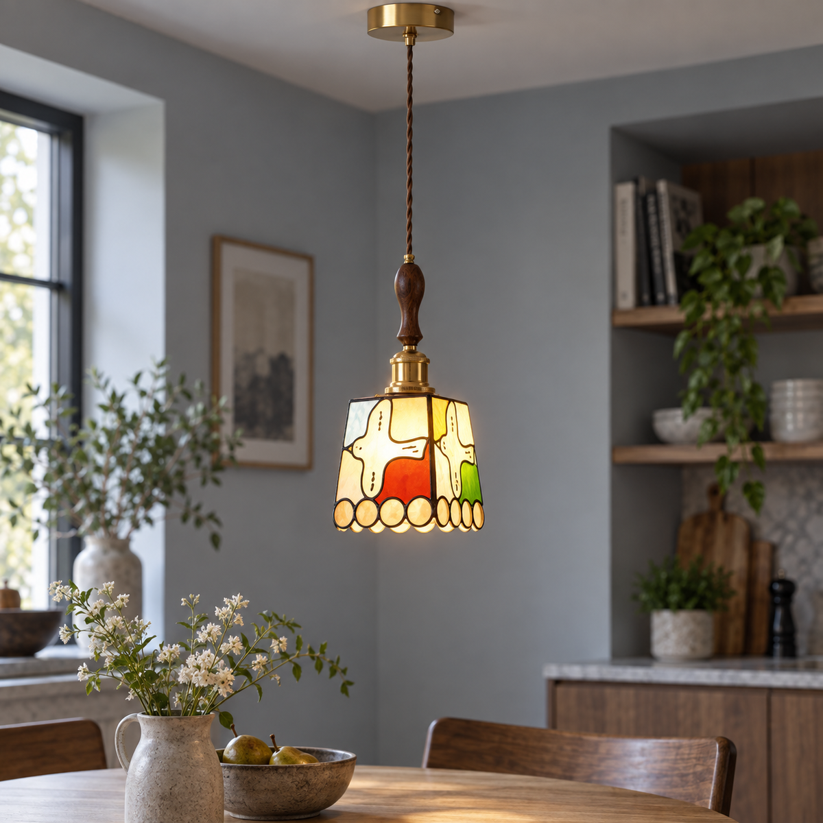 Cream and amber pattern stained-glass pendant, centred illuminated commercial view