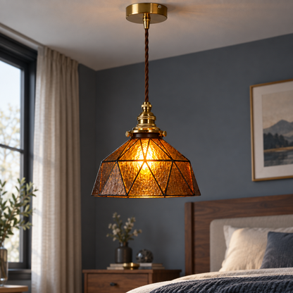 Amber geometric stained-glass pendant, centred illuminated commercial view