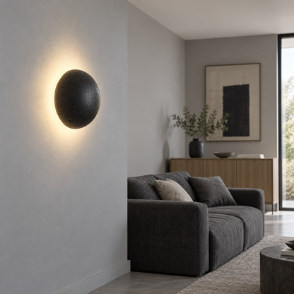 black stone dome wall light — side view installed in a complete room