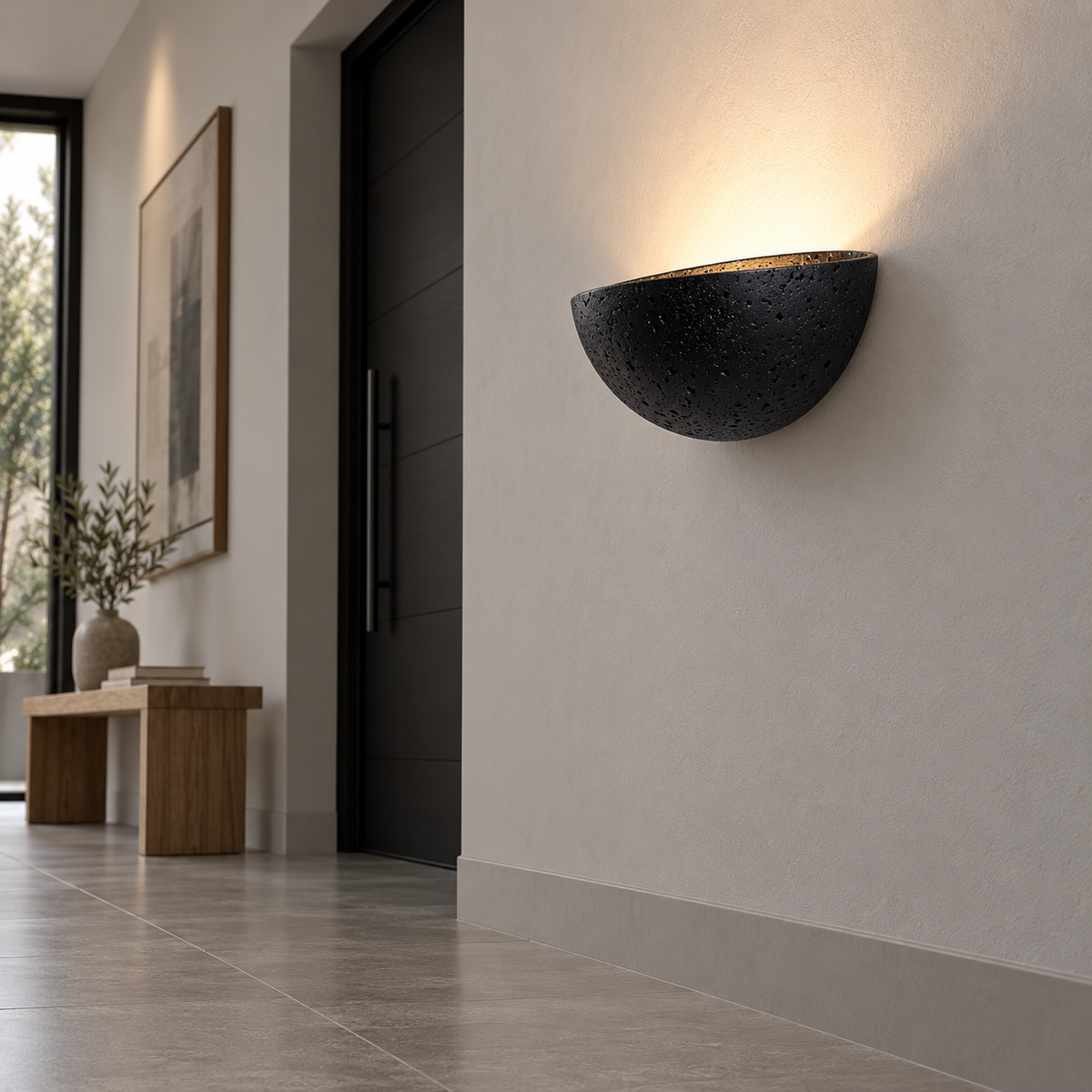 Underside view of the black stone half-moon uplight in an entrance hall